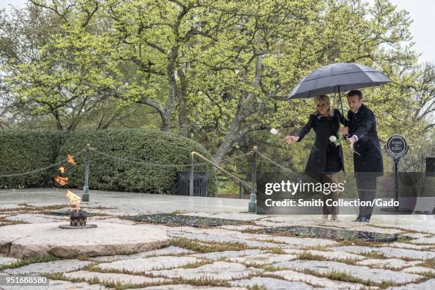 French President Emmanuel Macron and his wife, Brigitte Macron, lay roses on the gravesites of former President John F Kennedy and Jacqueline Bouvier...