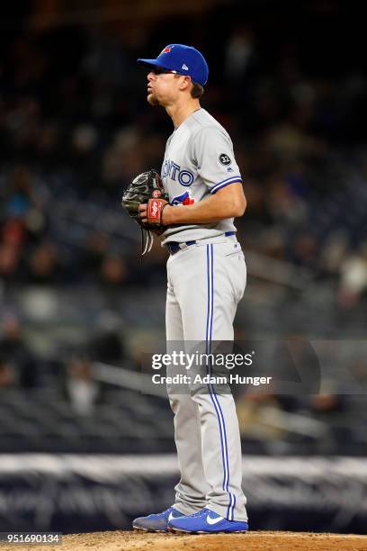 Tyler Clippard of the Toronto Blue Jays pitches against the New York Yankees during the eighth inning at Yankee Stadium on April 19, 2018 in the...