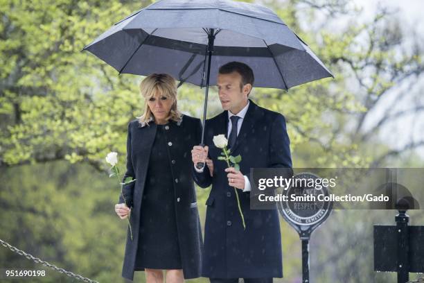 French President Emmanuel Macron and his wife, Brigitte Macron, lay roses on the gravesites of former President John F Kennedy and Jacqueline Bouvier...