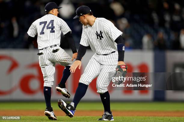 Aaron Judge of the New York Yankees celebrates with Ronald Torreyes of the New York Yankees after defeating the Toronto Blue Jays at Yankee Stadium...