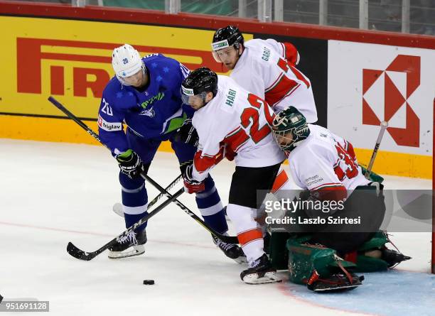 Sabahudin Kovacevic of Slovenia, Janos Hari of Hungary, Zsombor Garat of Hungary and Adam Vay of Hungary in action during the 2018 IIHF Ice Hockey...