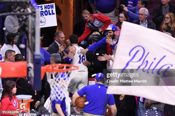 Marco Belinelli and Brian Colangelo of the Philadelphia 76ers celebrate after the game against the Miami Heat in game five of round one of the 2018...