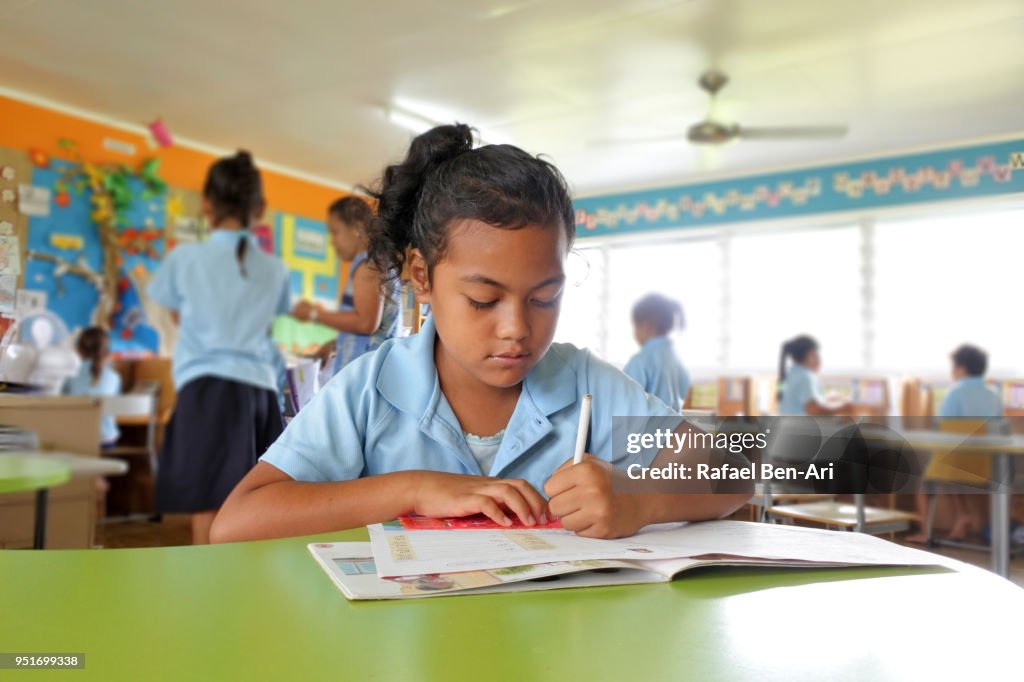 Young Pacific Islander girl study in school in Rarotonga Cook Islands