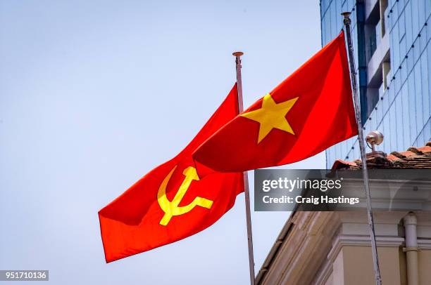 vietnam flags flying in the wind - hammer and sickle fotografías e imágenes de stock