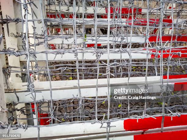 police army barbed wire riot fences - riot silhouette stock pictures, royalty-free photos & images