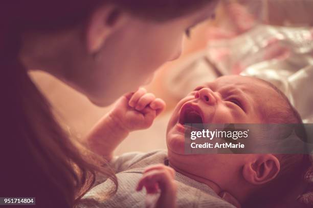 newborn baby girl crying - daughter crying stock pictures, royalty-free photos & images