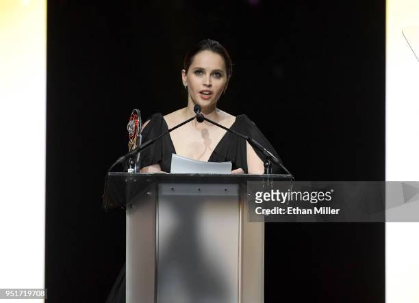 Actress Felicity Jones accepts the Award of Excellence in Acting onstage during the CinemaCon Big Screen Achievement Awards brought to you by the...