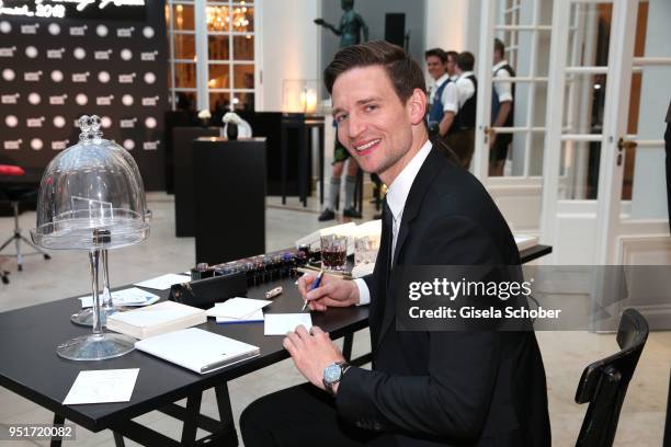 August Wittgenstein, Brand Ambassador Montblanc writes with a filler during the 27th Montblanc de la Culture Arts Patronage Award at Residenz on...