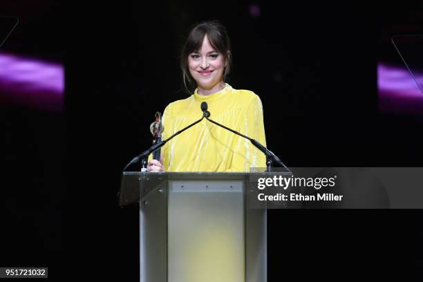 Actress Dakota Johnson accepts the Female Star of the Year award onstage during the CinemaCon Big Screen Achievement Awards brought to you by the...