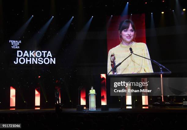 Actress Dakota Johnson accepts the Female Star of the Year award onstage during the CinemaCon Big Screen Achievement Awards brought to you by the...