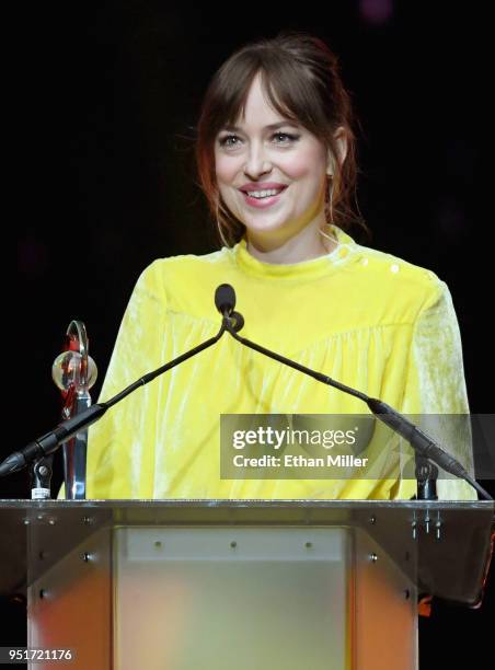 Actress Dakota Johnson accepts the Female Star of the Year award onstage during the CinemaCon Big Screen Achievement Awards brought to you by the...