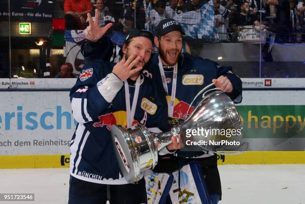 Keith Aucoin of Red Bull Munich and Danny aus den Birken of Red Bull Munich after winning the DEL Playoff final match seven between EHC Red Bull...