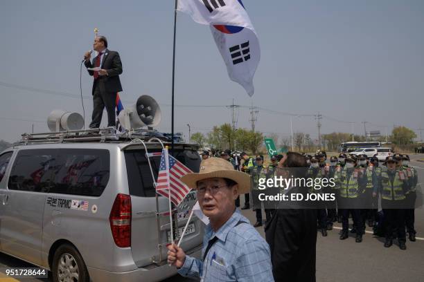 Anti-North Korea activists hold placards and shout slogans during a demonstration at the Imjingak Peace Park near the Tongil bridge checkpoint...