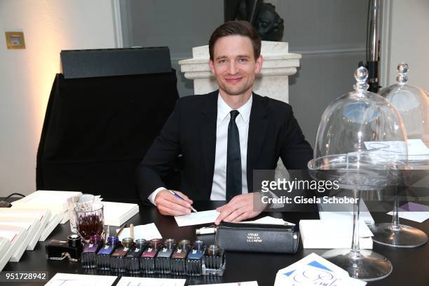August Wittgenstein, Brand Ambassador Montblanc writes with a filler during the 27th Montblanc de la Culture Arts Patronage Award at Residenz on...