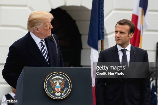 President Donald Trump speaks, with French President Emmanuel Macron by his side, at the arrival ceremony for President Macron on the South Lawn of...