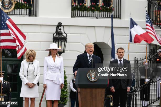 French First Lady Brigitte Macron, U.S. First Lady Melania Trump, U.S. President Donald Trump, and French President Emmanuel Macron, participate in...