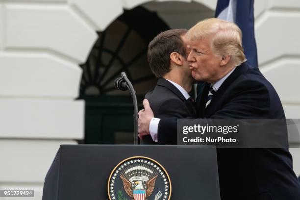 French President Emmanuel Macron, and U.S. President Donald Trump hug, at the arrival ceremony for President Macron on the South Lawn of the White...