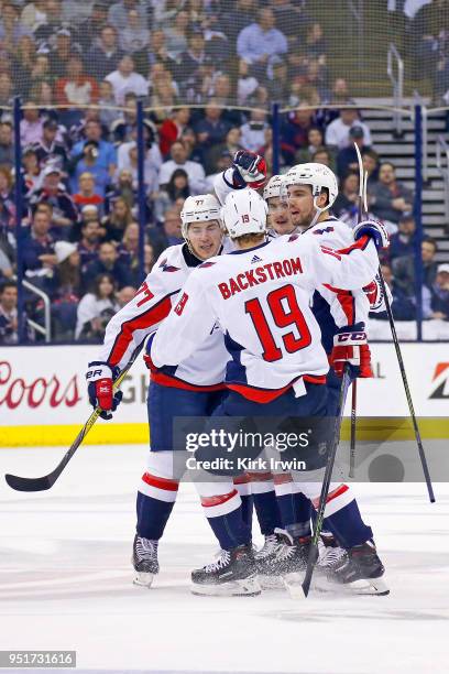 Dmitry Orlov of the Washington Capitals is congratulated by his teammates after scoring a goal in Game Six of the Eastern Conference First Round...