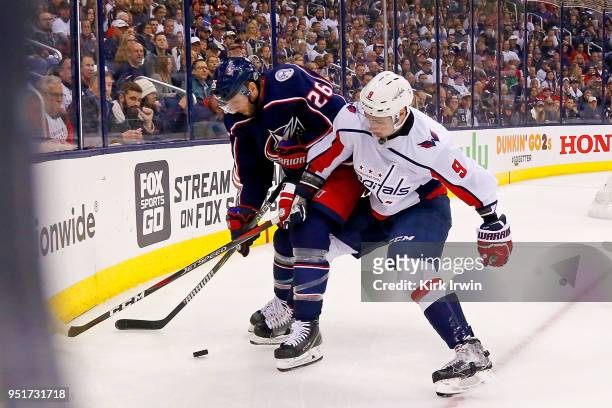 Thomas Vanek of the Columbus Blue Jackets and Dmitry Orlov of the Washington Capitals battle for control of the puck in Game Six of the Eastern...