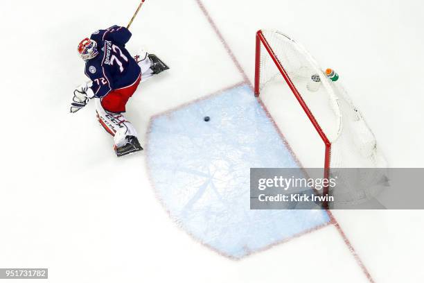 Sergei Bobrovsky of the Columbus Blue Jackets is unable to stop a shot from Devante Smith-Pelly of the Washington Capitals in Game Six of the Eastern...