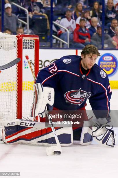 Sergei Bobrovsky of the Columbus Blue Jackets keeps control of the puck after loosing his helmet in Game Six of the Eastern Conference First Round...