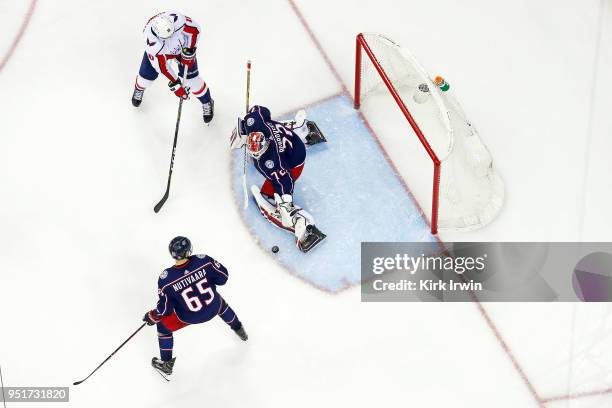 Sergei Bobrovsky of the Columbus Blue Jackets stops a shot from Brett Connolly of the Washington Capitals as Markus Nutivaara of the Columbus Blue...