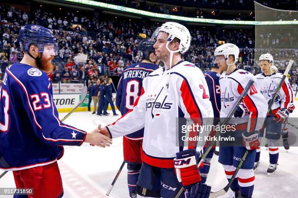 Ian Cole of the Columbus Blue Jackets shakes hands with Matt Niskanen of the Washington Capitals at the end of Game Six of the Eastern Conference...