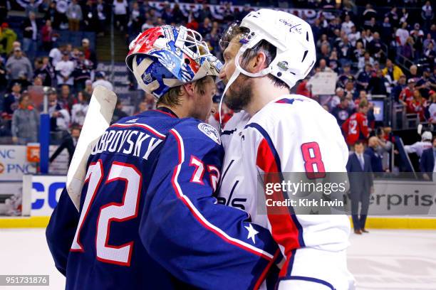 Sergei Bobrovsky of the Columbus Blue Jackets congratulates Alex Ovechkin of the Washington Capitals at the end of Game Six of the Eastern Conference...