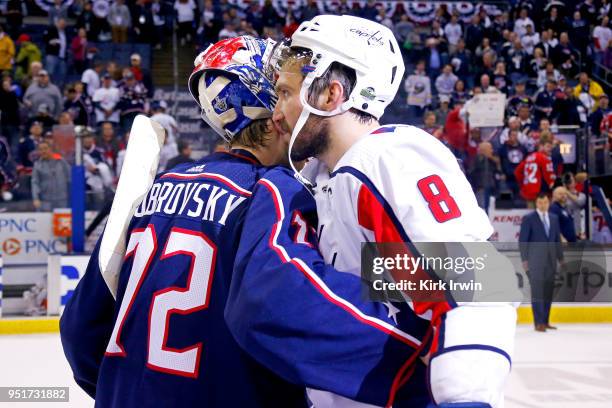 Sergei Bobrovsky of the Columbus Blue Jackets congratulates Alex Ovechkin of the Washington Capitals at the end of Game Six of the Eastern Conference...