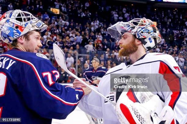 Sergei Bobrovsky of the Columbus Blue Jackets shakes hands with Braden Holtby of the Washington Capitals at the end of Game Six of the Eastern...