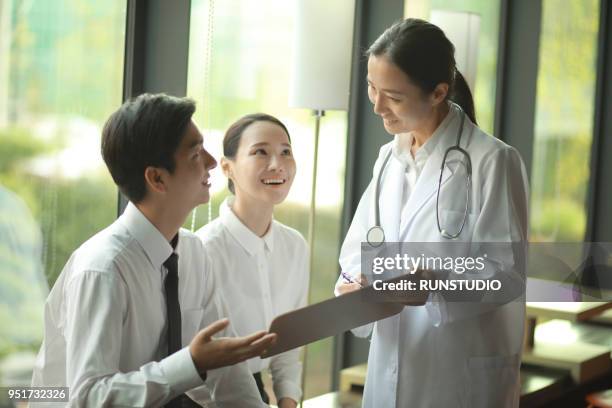 doctor talking with business people - japan and medical and hospital stock pictures, royalty-free photos & images