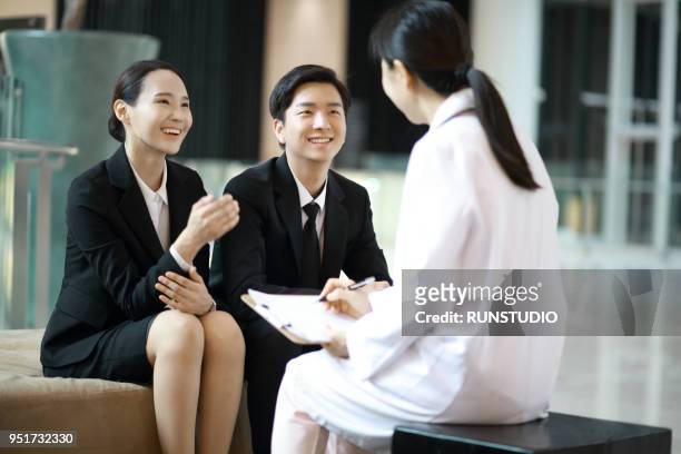 female doctor consulting with business people - salesman ストックフォトと画像