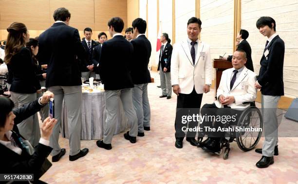 PyoengChang WInter Olympic Figure Skating Men's Single gold medalist Yuzuru Hanyu pose with paralympiains during their meeting with Japanese Prime...