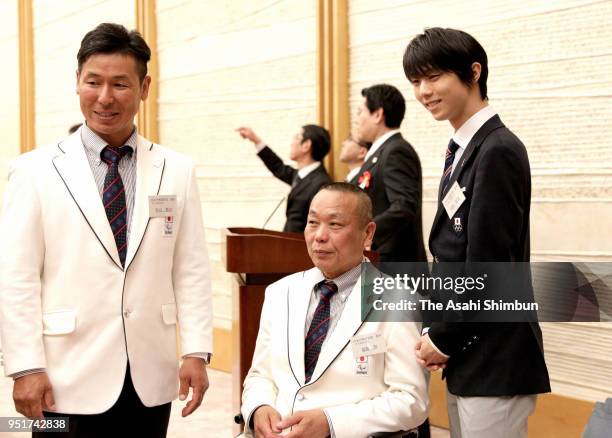 PyoengChang WInter Olympic Figure Skating Men's Single gold medalist Yuzuru Hanyu pose with paralympiains during their meeting with Japanese Prime...