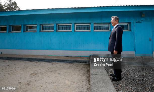 South Korean President Moon Jae-in awaits North Korean Leader Kim Jong Un's arrival at the military demarcation line prior to the Inter-Korean Summit...