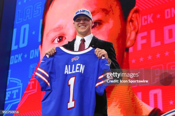 Josh Allen chosen as the seventh overall pick by the Buffalo Bills poses for photos during the first round at the 2018 NFL Draft at AT&T Statium on...