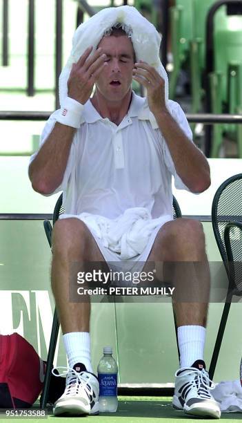 Todd Martin of the United States tries to cool down between sets by placing a towel of ice over his head,19 March, 2003 during the first round of...
