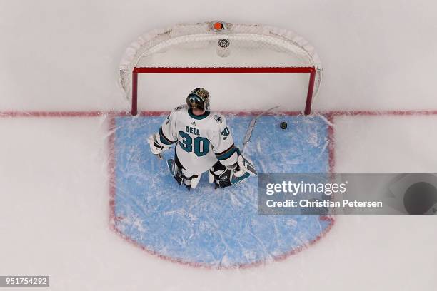 Goaltender Aaron Dell of the San Jose Sharks reacts after allowing a power-play goal to James Neal of the Vegas Golden Knights in the third period...