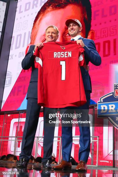 Josh Rosen poses for photos with NFL Commissioner Roger Goodell after being chosen by the Arizona Cardinals with the tenth overall pick during the...