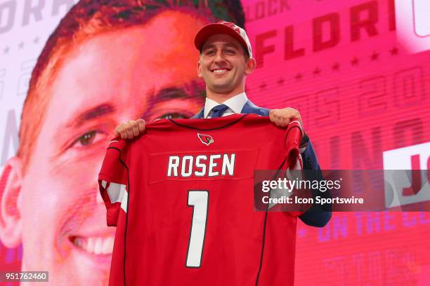 Josh Rosen poses with a jersey after being chosen by the Arizona Cardinals with the tenth overall pick during the first round at the 2018 NFL Draft...