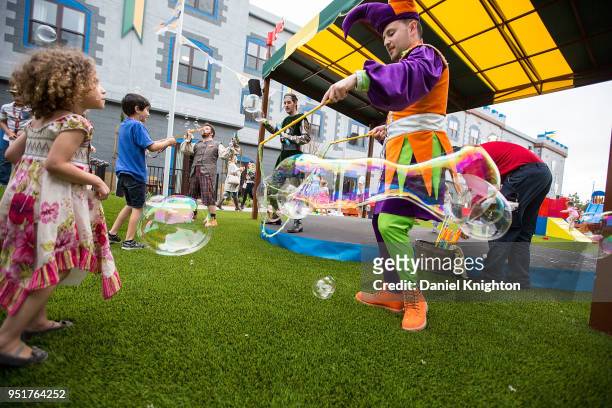 Jester makes bubbles for kids to play with at LEGOLAND Castle Hotel Grand Opening on April 26, 2018 in Carlsbad, California.