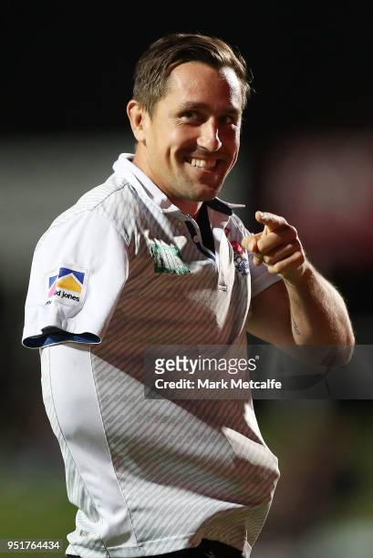 Mitchell Pearce of the Knights smiles to someone in the crowd during warm up before the Round eight NRL match between the Manly-Warringah Sea Eagles...