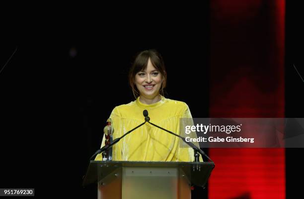 Actress Dakota Johnson accepts the "Female Star of the Year" award during the CinemaCon Big Screen Achievement Awards at The Colosseum at Caesars...