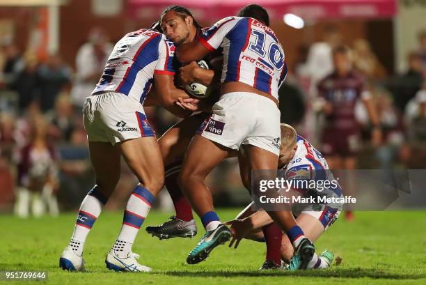 Martin Taupau of the Sea Eagles is tackled during the Round eight NRL match between the Manly-Warringah Sea Eagles and the Newcastle Knights at...