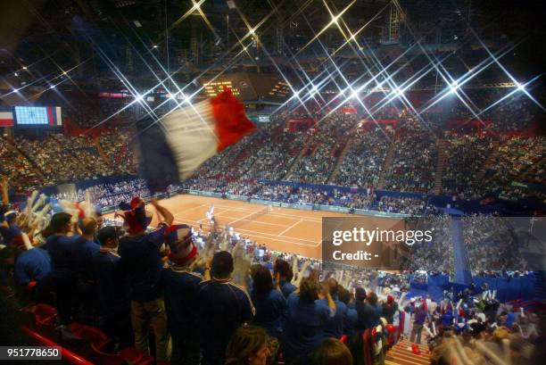 French supporters wave during the Davis cup final double match between French pair Nicolas Escude/Fabrice Santoro and Russia's Marat Safin/Yevgeny...