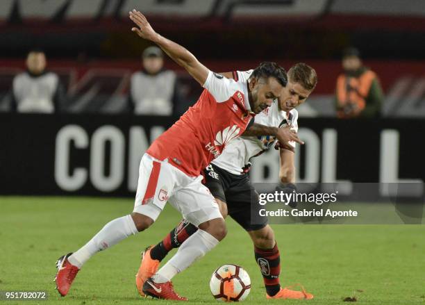 Armando Vargas of Santa Fe vies for the ball with Gustavo Cuellar of Flamengo during a match between Independiente Santa Fe and Flamengo as part of...