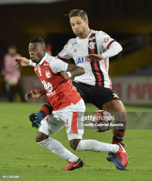 Carlos Arboleda of Santa Fe vies for the ball with of Flamengo during a match between Independiente Santa Fe and Flamengo as part of Copa CONMEBOL...