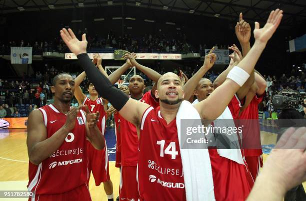EclipseJet's players celebrate after defeating Mons during their Eurochallenge basketball match on March 10 in Mons. Amsterdam won 86-93. AFP PHOTO/...