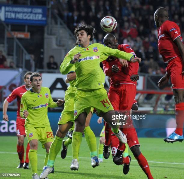 Twente's Blaise N'Kufo vies with Steaua Boekarest-player Juan Toja during the Euro League match in Enschede, The Netherlands, on October 1, 2009. AFP...