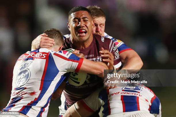 Jacob Saifiti of the Knights is tackled during the Round eight NRL match between the Manly-Warringah Sea Eagles and the Newcastle Knights at...